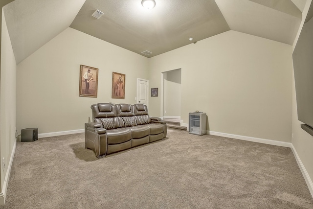 living area featuring carpet floors, lofted ceiling, and visible vents