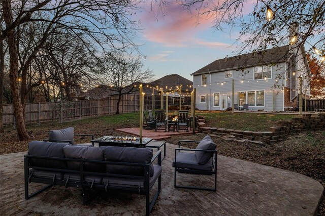 view of patio featuring an outdoor living space and a fenced backyard
