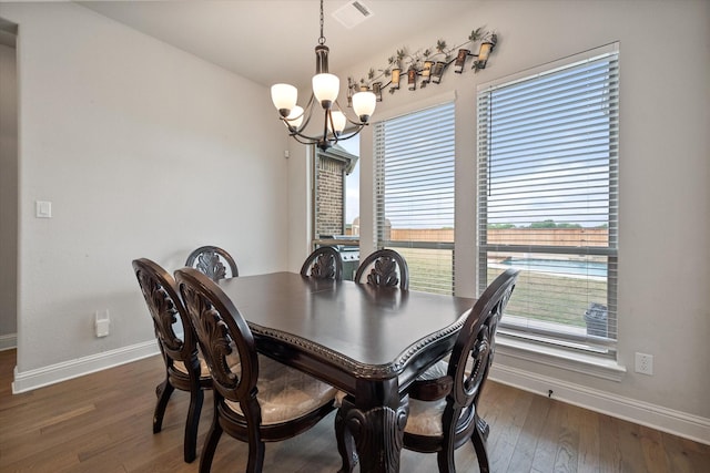 351 Evening Fire Dr, Waxahachie, TX 75167 - dining area featuring baseboards, a notable chandelier, wood finished floors, and visible vents