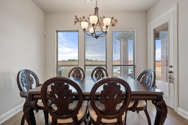 351 Evening Fire Dr, Waxahachie, TX 75167 - dining space with dark wood finished floors, visible vents, baseboards, and a notable chandelier