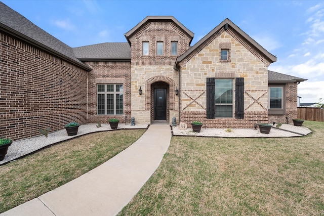 351 Evening Fire Dr, Waxahachie, TX 75167 - french country inspired facade with brick siding, a shingled roof, a front yard, and fence
