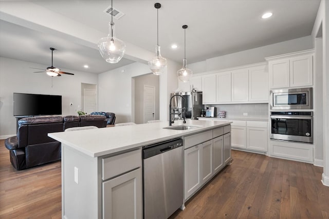 351 Evening Fire Dr, Waxahachie, TX 75167 - kitchen with hardwood / wood-style floors, stainless steel appliances, visible vents, and a sink
