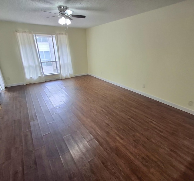 4859 Cedar Springs Rd Unit 358, Dallas, TX 75219 - unfurnished room with a textured ceiling, ceiling fan, dark wood-type flooring, and baseboards
