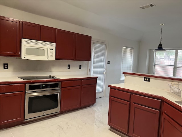 kitchen with visible vents, marble finish floor, oven, white microwave, and black electric cooktop