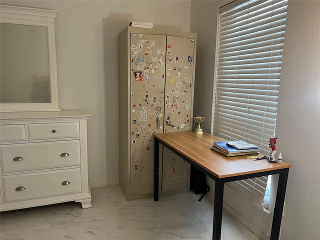 home office featuring marble finish floor