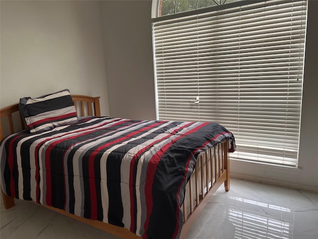 bedroom with marble finish floor