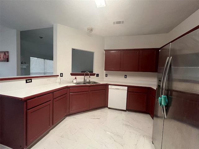kitchen with stainless steel refrigerator with ice dispenser, visible vents, dishwasher, a sink, and marble finish floor