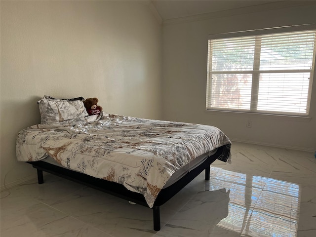 bedroom featuring ornamental molding and marble finish floor