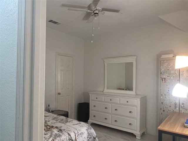bedroom featuring a ceiling fan, marble finish floor, and visible vents