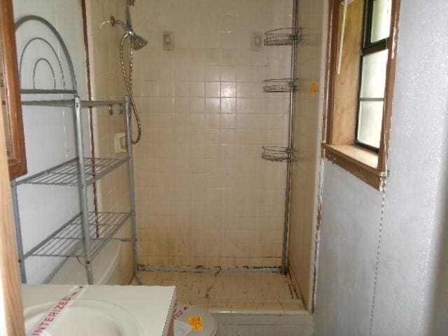 bathroom featuring vanity, toilet, and a stall shower