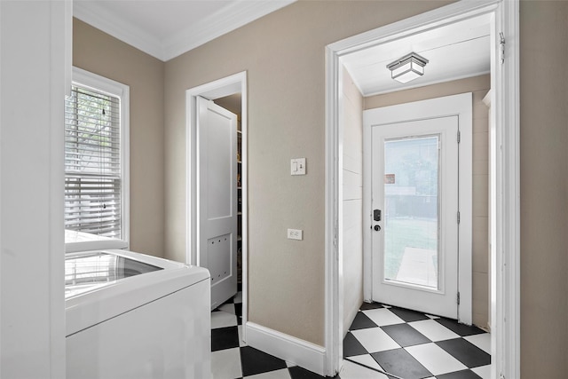doorway to outside with washer / dryer, ornamental molding, and tile patterned floors