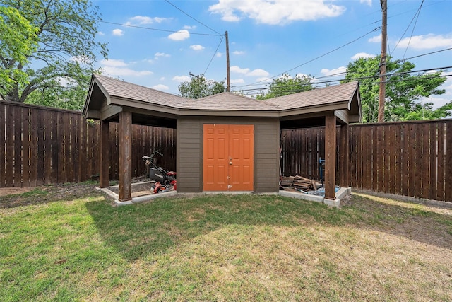 view of shed featuring a fenced backyard