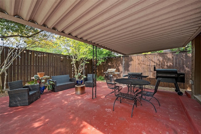 view of patio / terrace with a fenced backyard, outdoor dining area, and a grill
