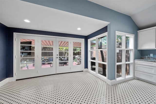unfurnished sunroom featuring french doors