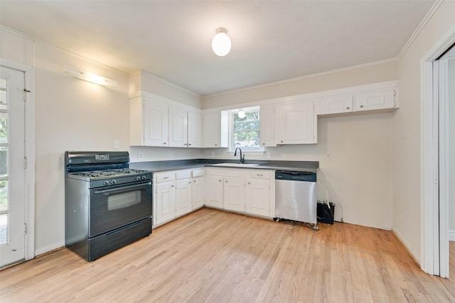 kitchen with light wood finished floors, black gas range oven, dark countertops, dishwasher, and a sink