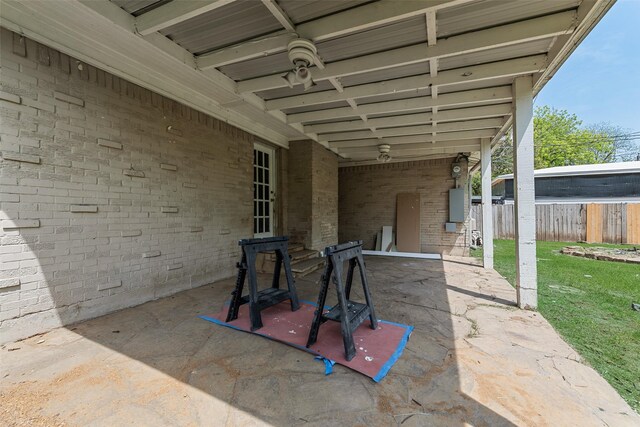 view of patio / terrace featuring fence