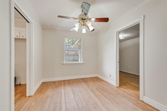 unfurnished bedroom featuring light wood-type flooring, baseboards, and ornamental molding