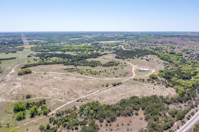 birds eye view of property with a rural view