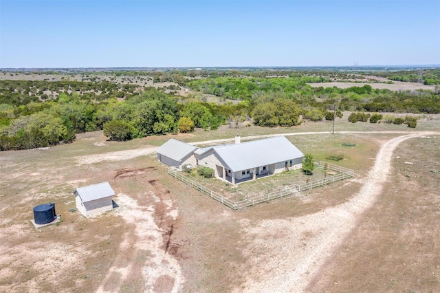 birds eye view of property with a rural view