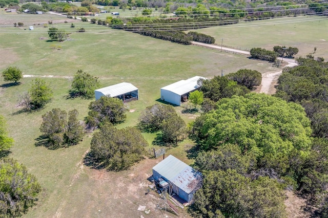 birds eye view of property with a rural view