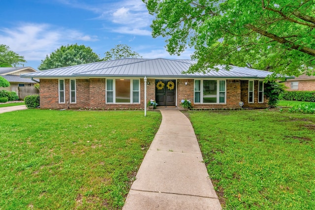 1806 Elm Crest Dr, Arlington, TX 76012 - ranch-style home featuring a standing seam roof, brick siding, a front lawn, and metal roof