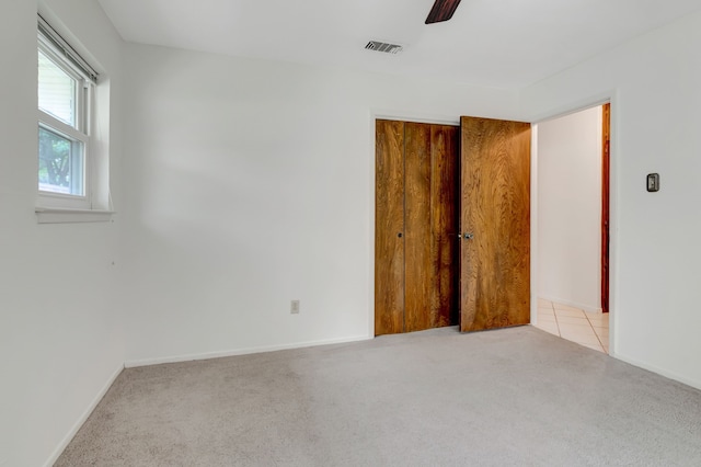 1806 Elm Crest Dr, Arlington, TX 76012 - unfurnished bedroom featuring light carpet, a closet, baseboards, and ceiling fan