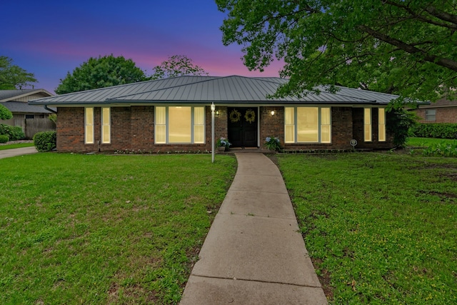 1806 Elm Crest Dr, Arlington, TX 76012 - ranch-style house featuring a standing seam roof, brick siding, and a yard