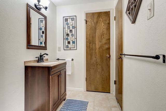 1806 Elm Crest Dr, Arlington, TX 76012 - bathroom with tile patterned floors, vanity, and baseboards