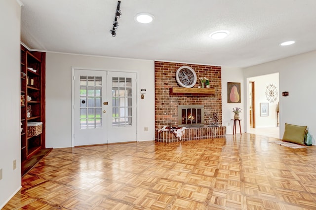 1806 Elm Crest Dr, Arlington, TX 76012 - living room with french doors, a textured ceiling, and a brick fireplace