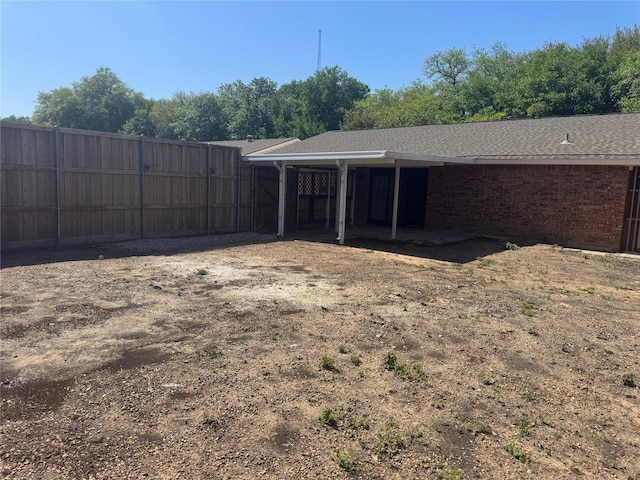 back of property with fence