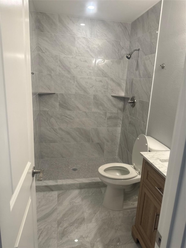 full bathroom with toilet, a shower stall, vanity, and recessed lighting