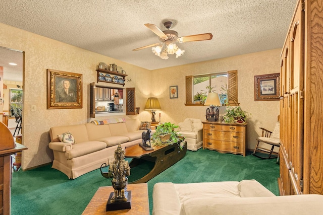 carpeted living area with ceiling fan, a textured wall, and a textured ceiling