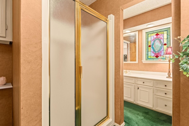 full bathroom with a shower stall and vanity