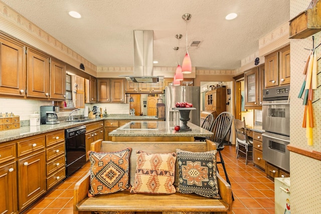 kitchen featuring a textured ceiling, a sink, brown cabinetry, black appliances, and island exhaust hood
