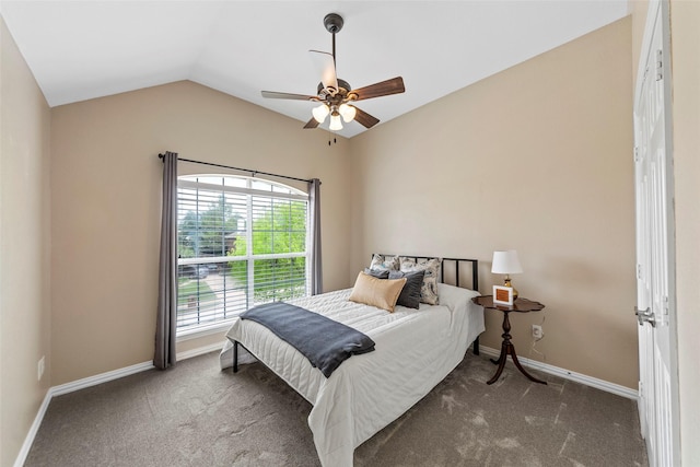 bedroom featuring lofted ceiling, carpet flooring, and baseboards