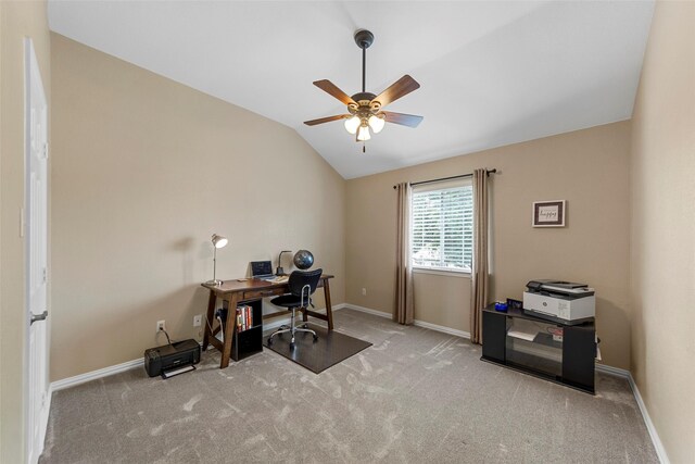 office space featuring vaulted ceiling, a ceiling fan, carpet flooring, and baseboards