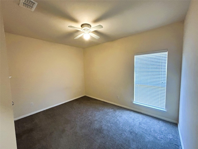 4303 Grassy Glen Dr, Corinth, TX 76208 - unfurnished room featuring ceiling fan, dark carpet, and baseboards