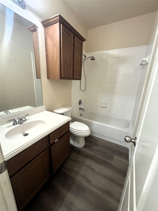 4303 Grassy Glen Dr, Corinth, TX 76208 - full bathroom with wood finished floors, vanity, toilet, and bathing tub / shower combination