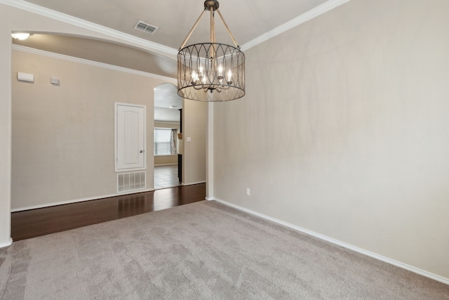 601 Wichita Trl, Mckinney, TX 75071 - unfurnished room with visible vents, arched walkways, a notable chandelier, and carpet floors