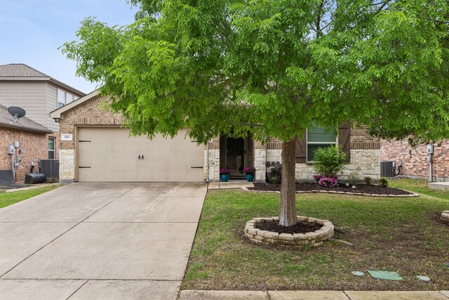 601 Wichita Trl, Mckinney, TX 75071 - obstructed view of property with central air condition unit, a garage, driveway, stone siding, and brick siding