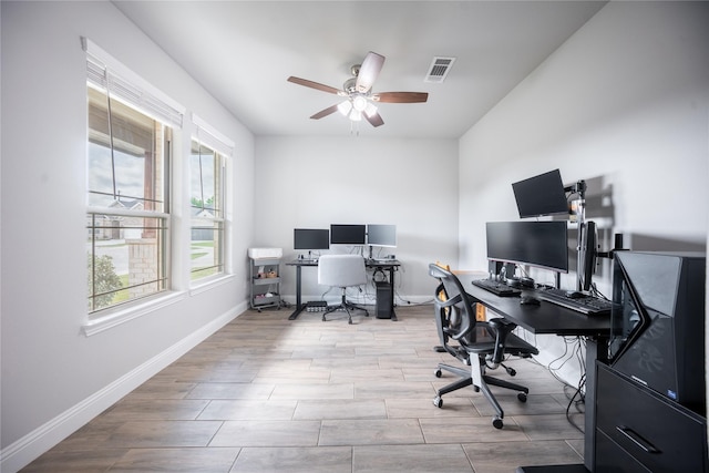 office space featuring ceiling fan, baseboards, wood finished floors, and visible vents