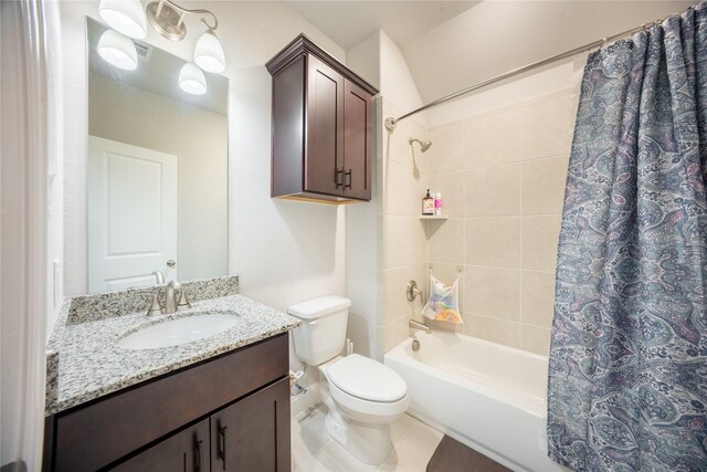 bathroom featuring shower / tub combo, toilet, and vanity