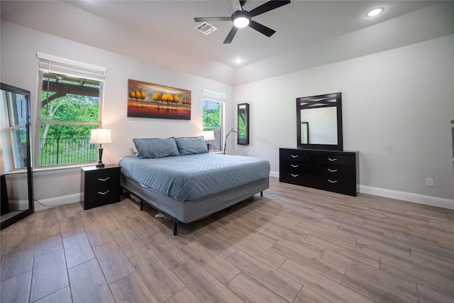 bedroom with light wood finished floors, baseboards, visible vents, and recessed lighting
