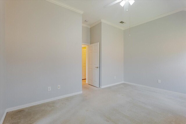 unfurnished room featuring ceiling fan, baseboards, ornamental molding, and light colored carpet
