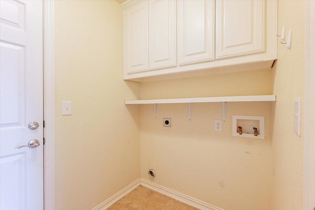 clothes washing area with cabinet space, hookup for a washing machine, baseboards, and hookup for an electric dryer
