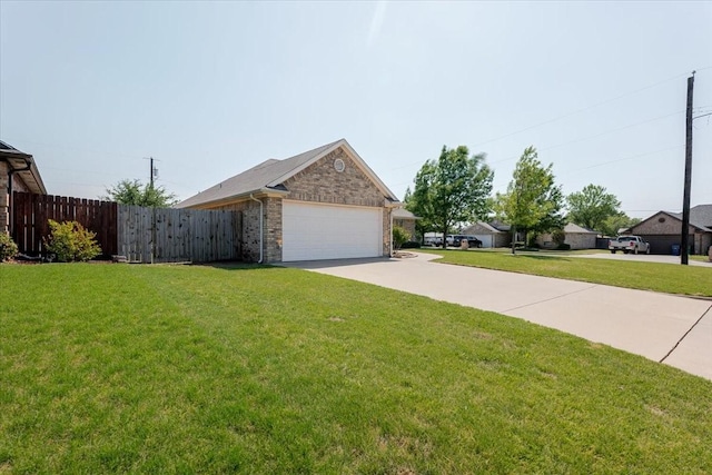 view of side of home featuring concrete driveway, fence, brick siding, a garage, and a lawn