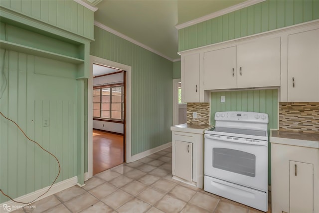 kitchen featuring white electric range oven, crown molding, tasteful backsplash, and white cabinets