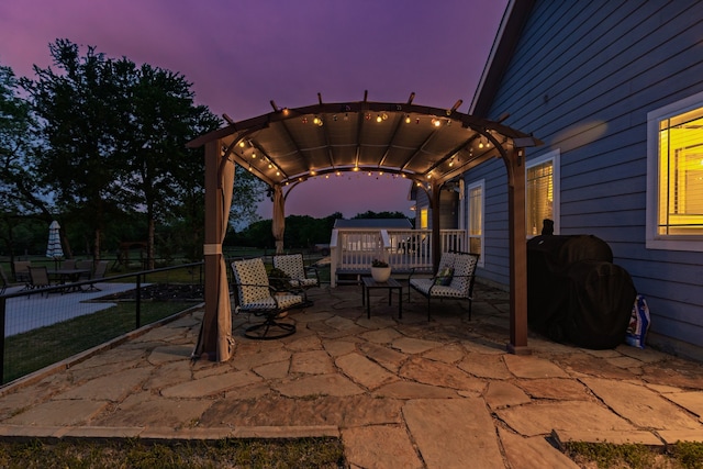 view of patio with a pergola and area for grilling