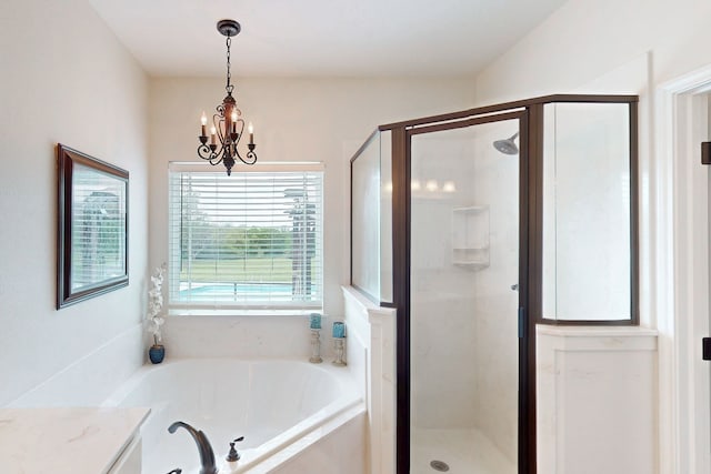 full bathroom featuring a garden tub, a notable chandelier, and a stall shower