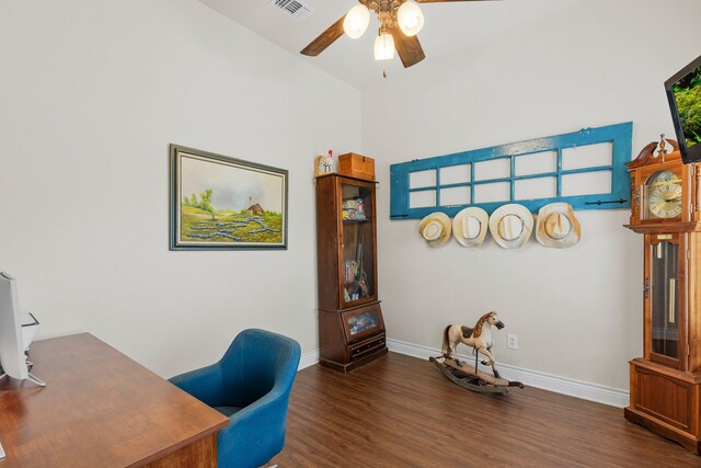 office area with wood finished floors, visible vents, a ceiling fan, and baseboards